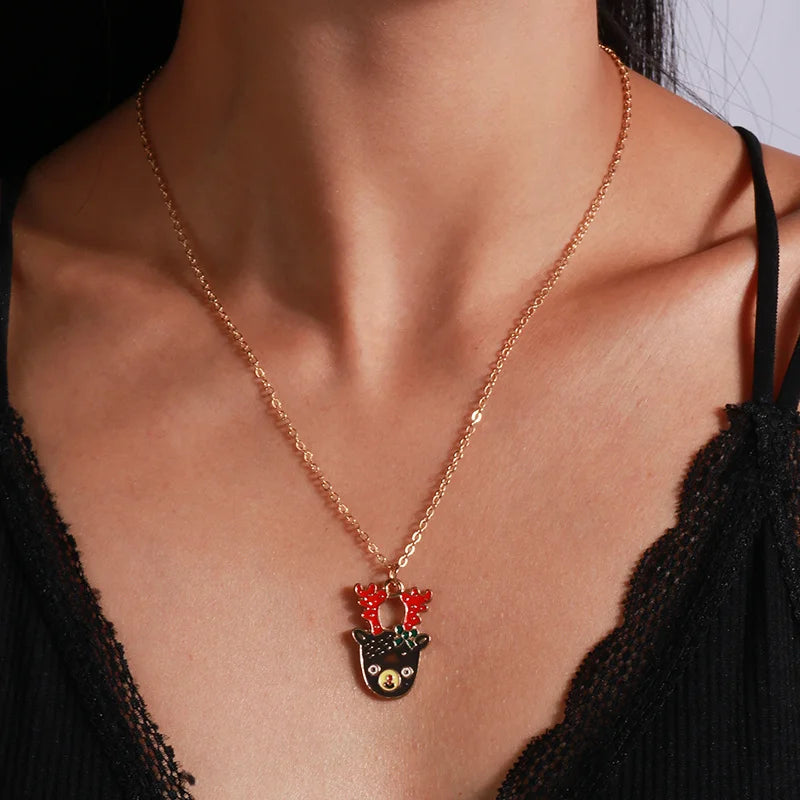 Kerst ketting met kerstboom, kerstman en belletjes hanger – feestelijke sieraden voor dames