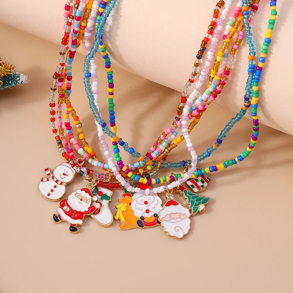 Kerst ketting set met kerstboom, kerstman en sneeuwpop hangers – feestelijke sieraden - 7 stuks