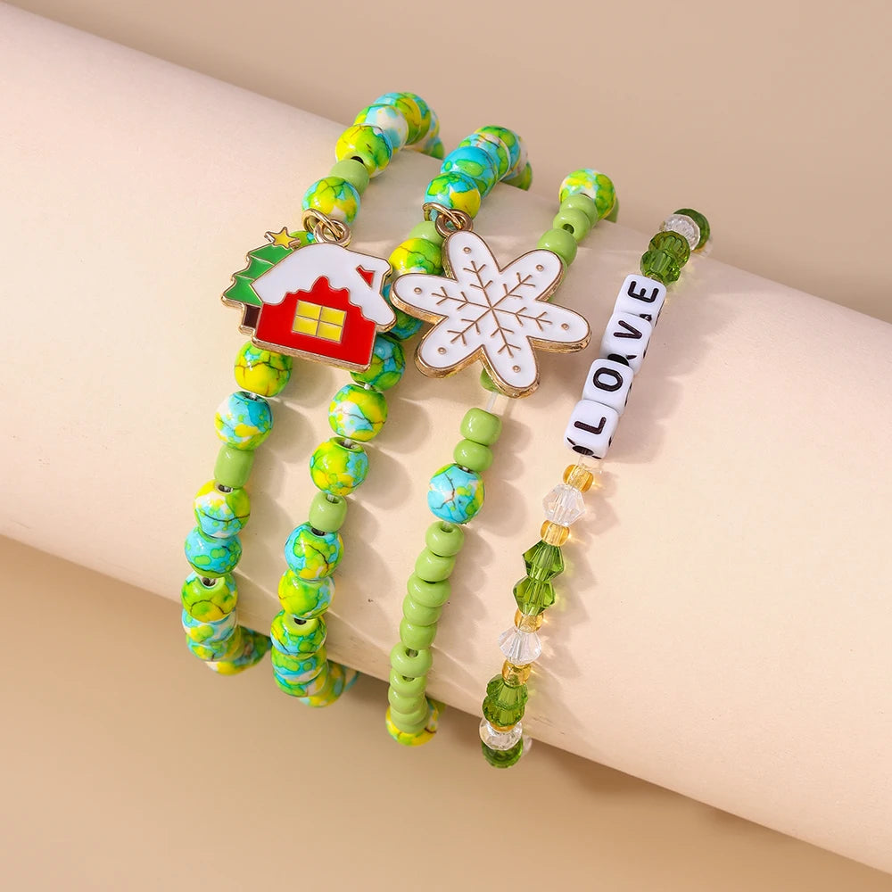Kerst armbanden set met Kerstman, rendier en sneeuwpop bedels