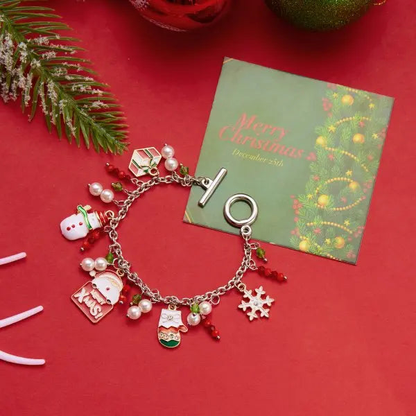 Kerst armband met kerstboom, sneeuwvlok, kerstman en belletjes
