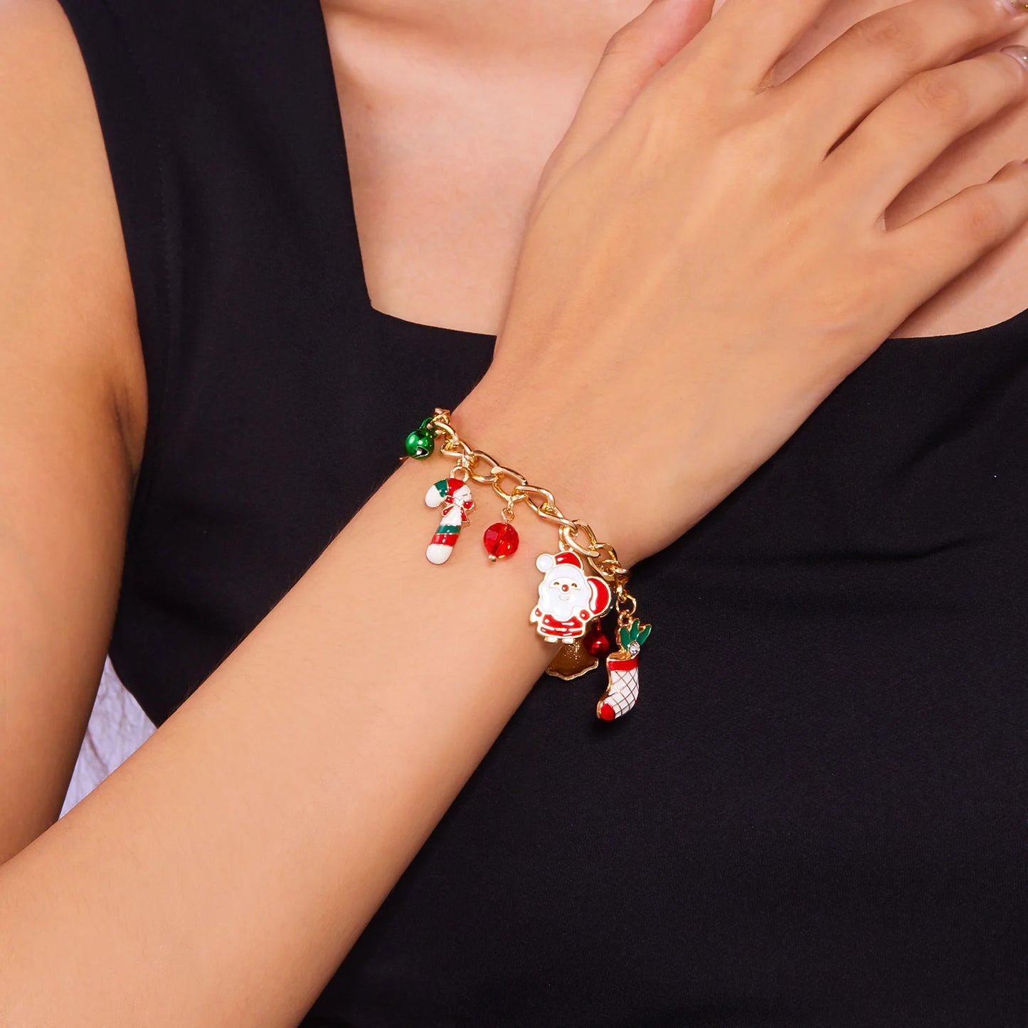 Kerst armband met kerstboom, sneeuwvlok, kerstman en belletjes