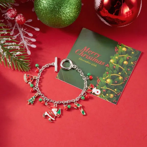 Kerst armband met kerstboom, sneeuwvlok, kerstman en belletjes