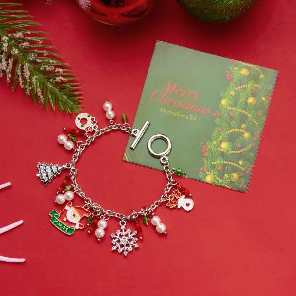 Kerst armband met kerstboom, sneeuwvlok, kerstman en belletjes