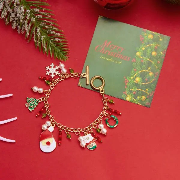 Kerst armband met kerstboom, sneeuwvlok, kerstman en belletjes