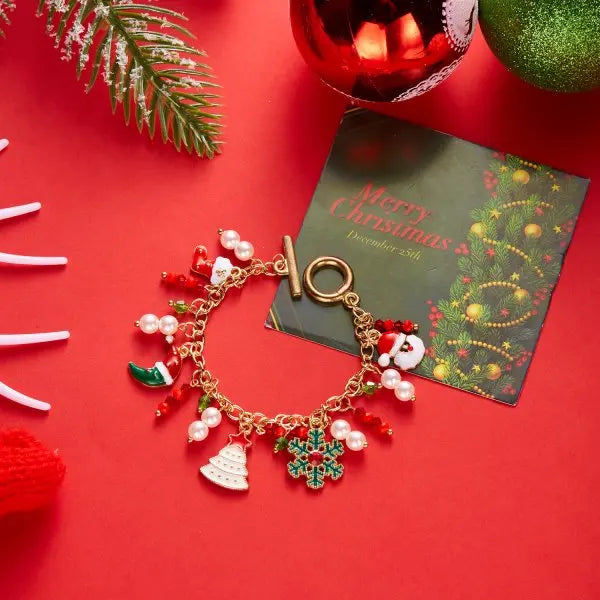 Kerst armband met kerstboom, sneeuwvlok, kerstman en belletjes